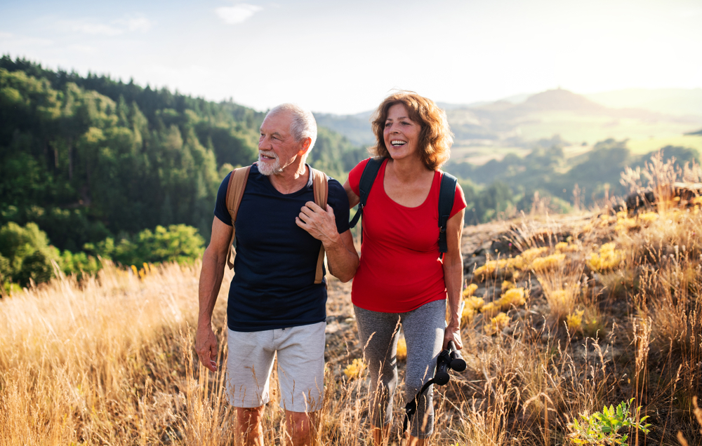 Senior couple walking in nature.