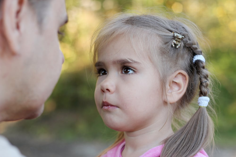 Pretty,Small,Girl,With,Two,Braids,Looking,On,Her,Father