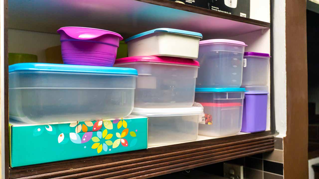 outdated plastic containers that need to be organized.