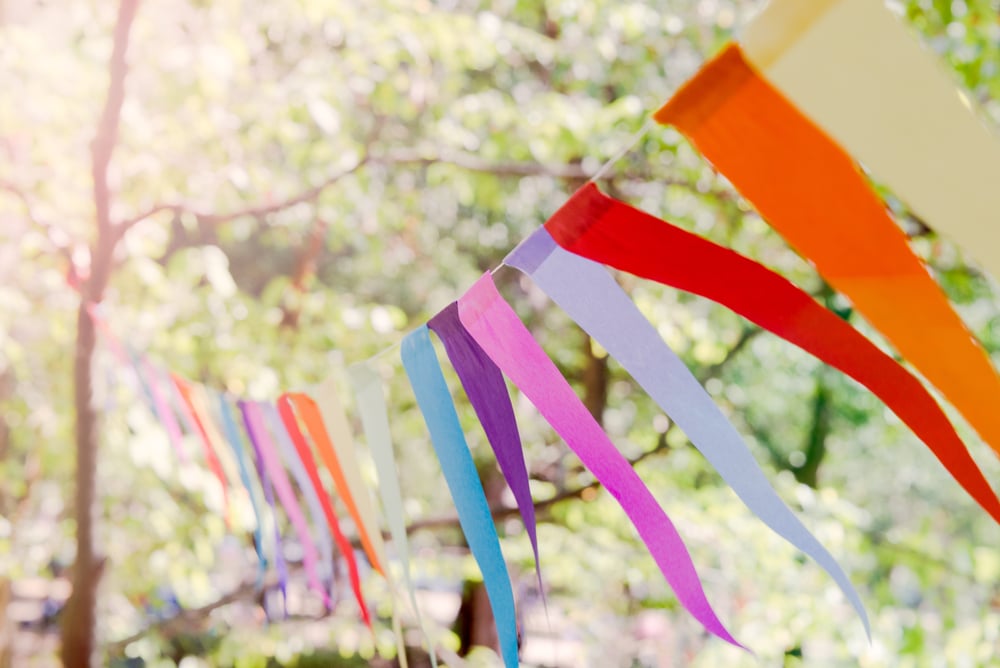 streamers hang from a tree