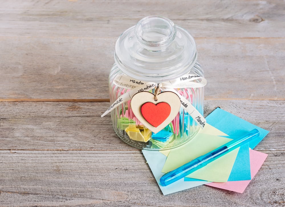 Glass,Jar,With,Handmade,Wooden,Hearts,Decorations,And,Ribbon,Near