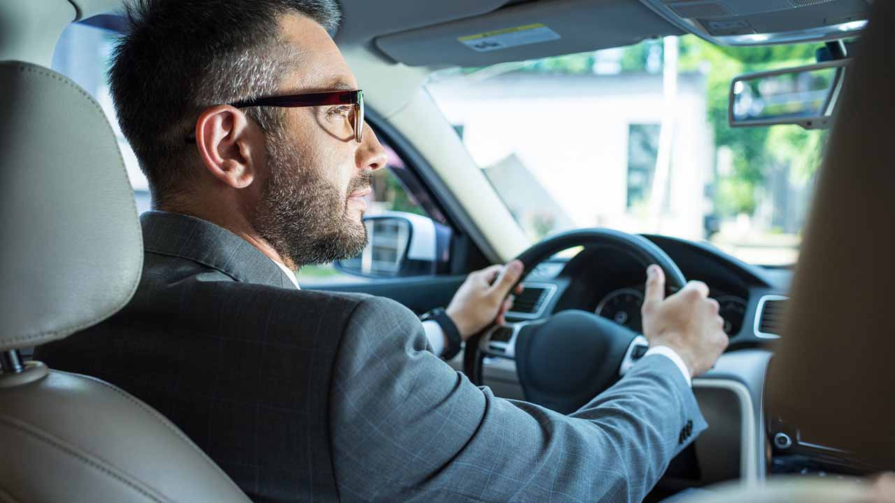 man driving car