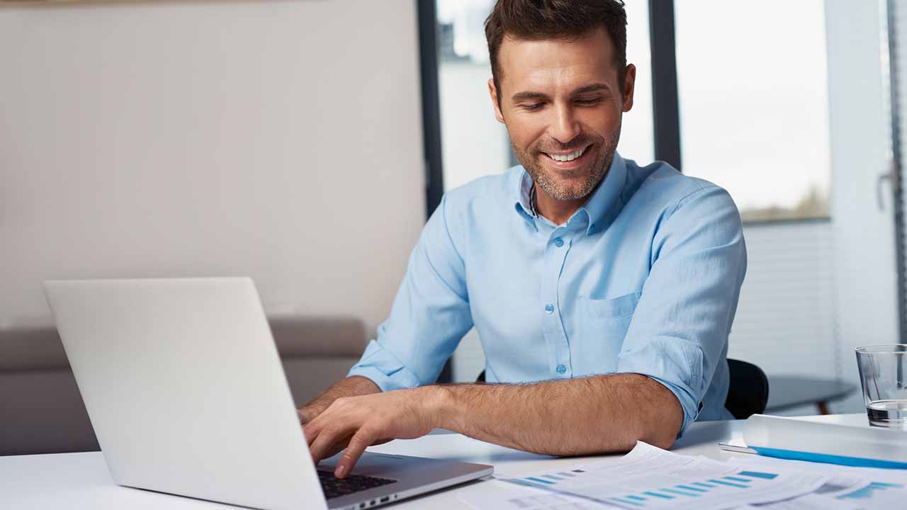 Man entering data from printed copies.