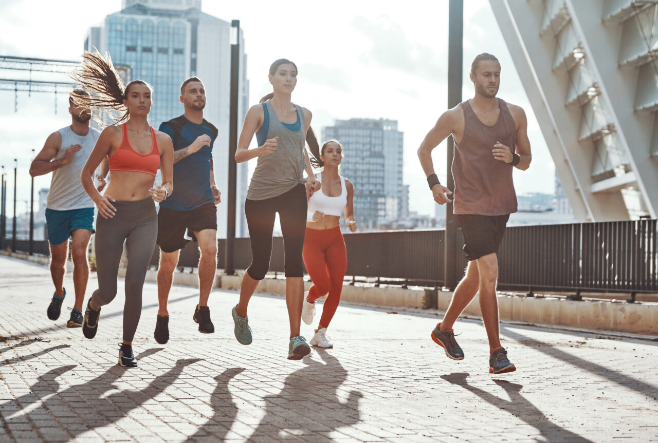 Group of people running together for exercise.